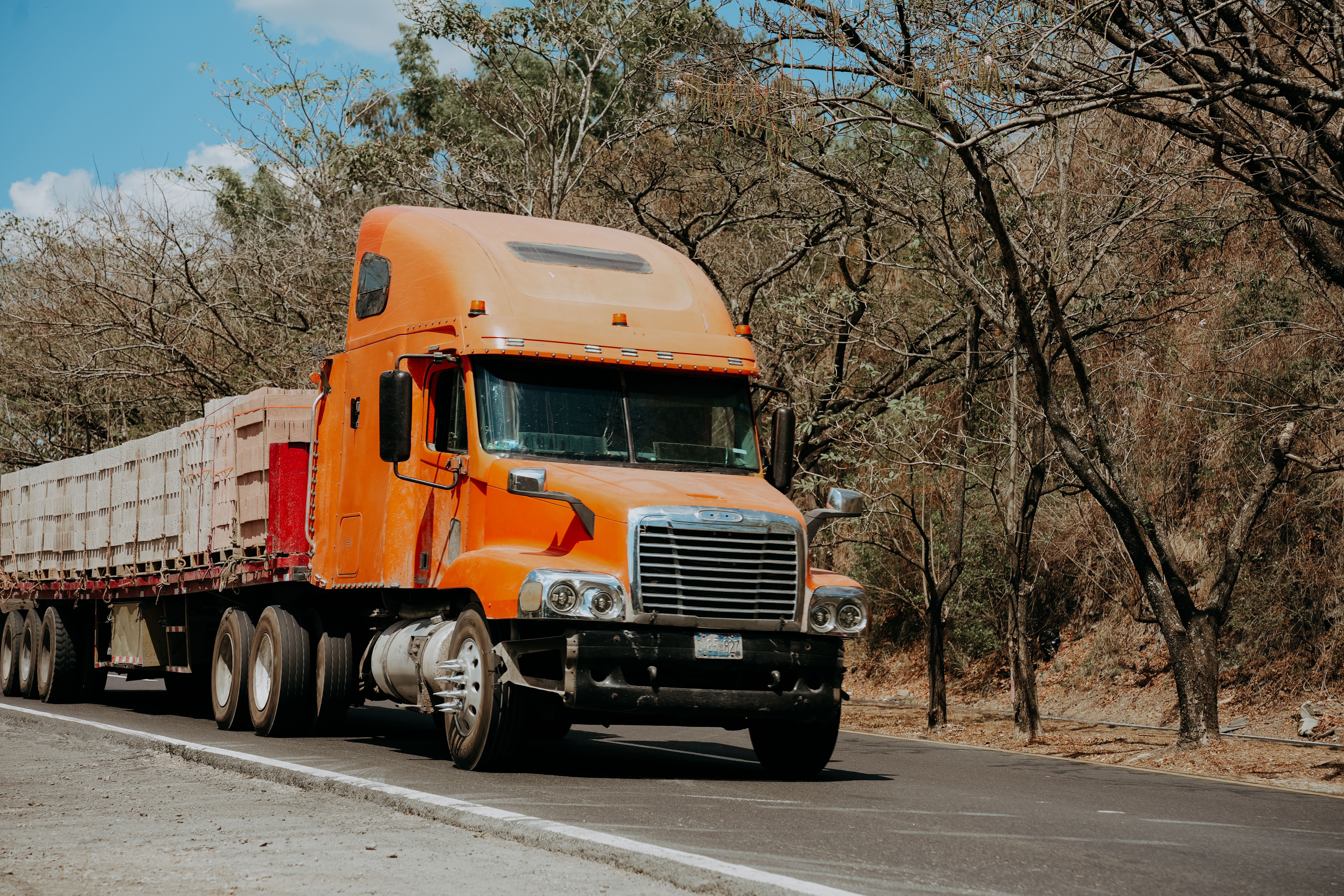 A semi-truck driving on a highway, representing long-haul freight transport across Jacksonville, FL and beyond.